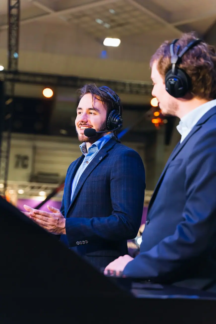 Robert Jan on a Red Bull stage event speaking into microphone during production.